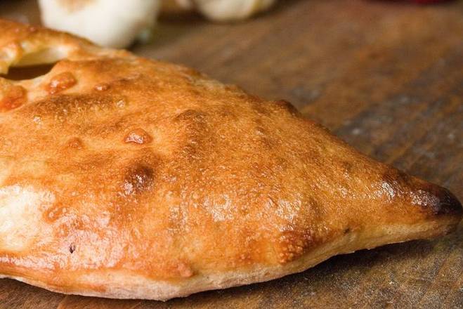 Order Traditional Calzone food online from NYPD Pizza store, Orlando on bringmethat.com