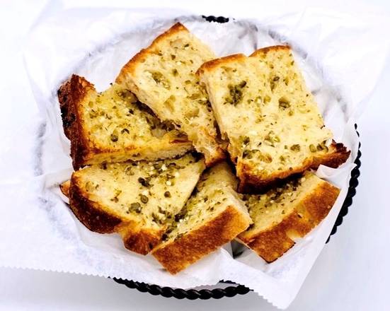 Order  Bread Grilled with Capers & Garlic Butter - Large food online from Dali Restaurant & Tapas Bar store, Somerville on bringmethat.com