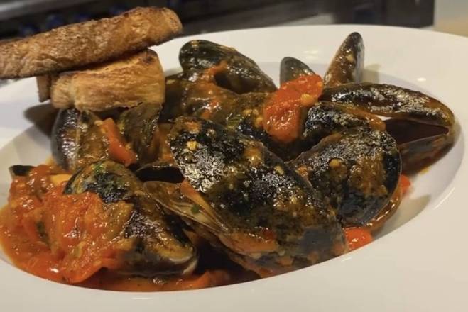 Order Sauteed Mussels Venezia style food online from Caffe Di Mauro store, Miami Beach on bringmethat.com
