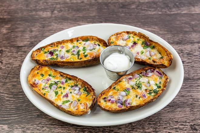 Order BBQ Chicken Potato Skins food online from Wood Ranch BBQ & Grill store, Rancho Santa Margarita on bringmethat.com