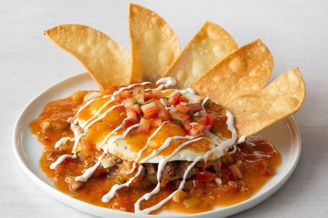 Order Tres Huevos Rancheros* food online from Village Inn store, Springfield on bringmethat.com