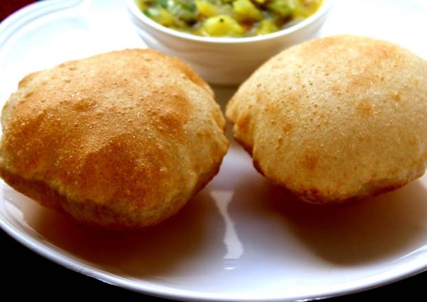 Order Poori (bread) 2 PC food online from Mezban Restaurant store, Houston on bringmethat.com