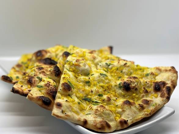 Order GARLIC NAAN food online from Paradise Biryani Pointe store, Dublin on bringmethat.com