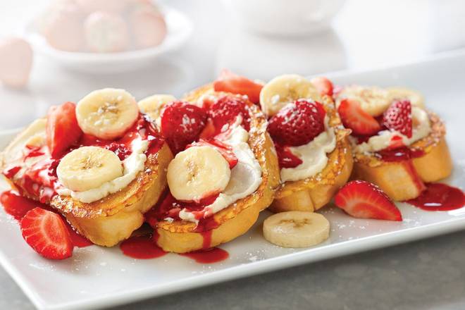 Order Strawberry-Banana Supreme French Toast food online from Village Inn store, Greeley on bringmethat.com