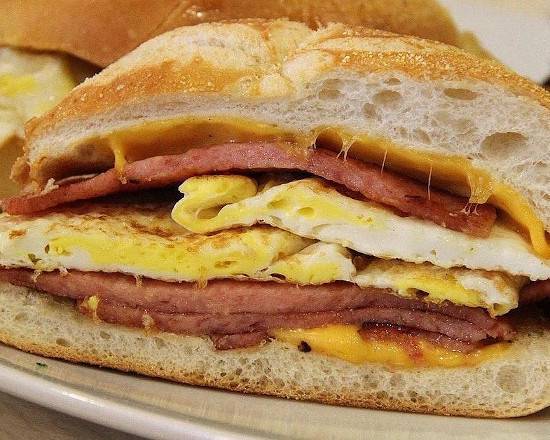 Order Turkey Bacon Eggs Cheese & Hashbrown on roll  food online from Brooklyn Bagel Boys store, New York on bringmethat.com