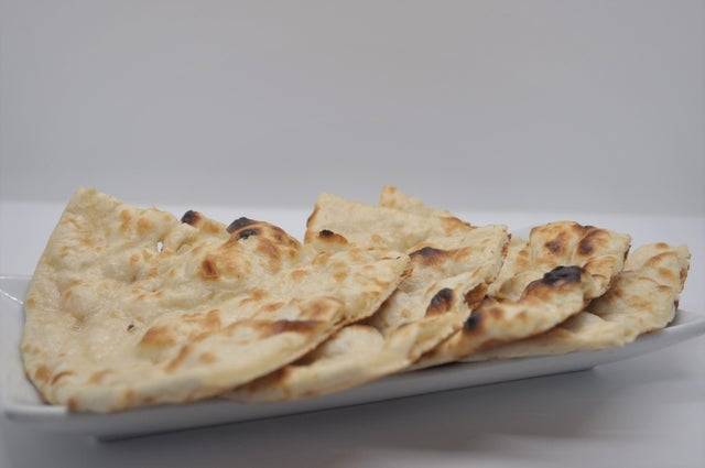 Order PLAIN NAAN food online from Paradise Biryani Pointe store, Dublin on bringmethat.com