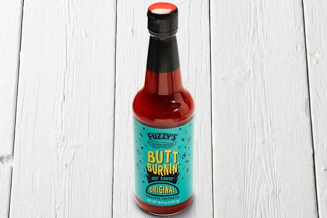 Order Butt Burnin' Hot Sauce Bottle (10 oz) food online from Fuzzy's Taco Shop store, Beaumont on bringmethat.com