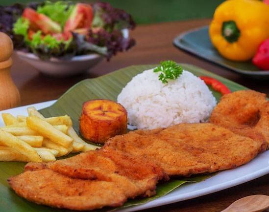 Order Pork Milanese - Chuleta Caleña with 3 sides + 1 Coca Cola Gratis food online from Medellin Restaurant store, Coconut Creek on bringmethat.com