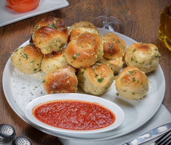 Order Garlic Knots (12 pcs) food online from Mangiano Pizza Restaurant & Catering store, Hanover on bringmethat.com