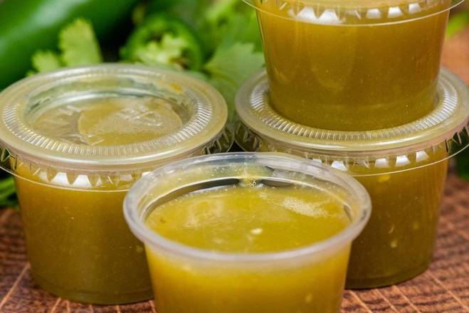 Order 4 small green sauce (1oz, small) food online from La Victoria Taqueria store, San Jose on bringmethat.com
