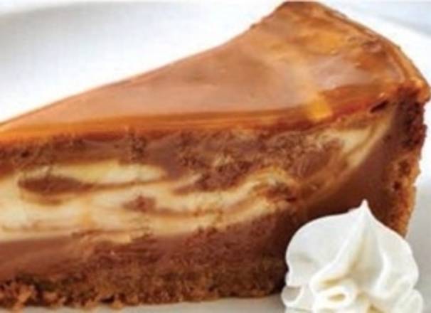 Order CARAMEL CHEESE CAKE food online from Ovation Bistro & Bar-Lakeland store, Lakeland on bringmethat.com
