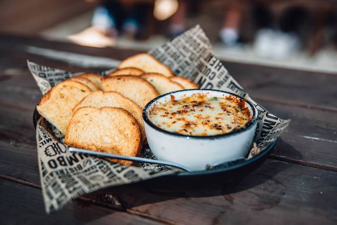Order Spinach and Artichoke Dip food online from Walk-On Sports Bistreaux store, Tallahassee on bringmethat.com