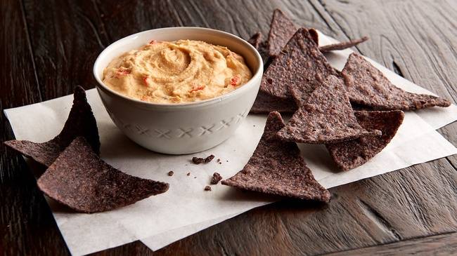 Order Red Pepper Hummus (Pint) (220 cal per 4 oz) food online from Jason's Deli store, Abilene on bringmethat.com