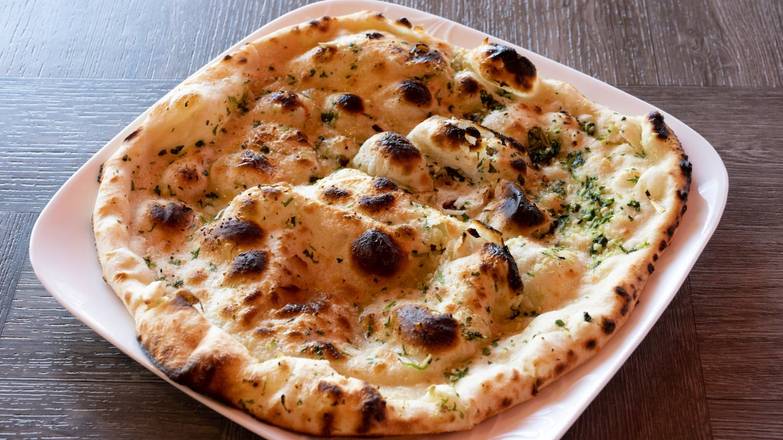 Order Garlic Naan food online from India's Flavor store, Glendale on bringmethat.com