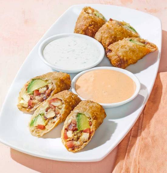 Order AVOCADO CLUB EGG ROLLS food online from California Pizza Kitchen store, Orlando on bringmethat.com