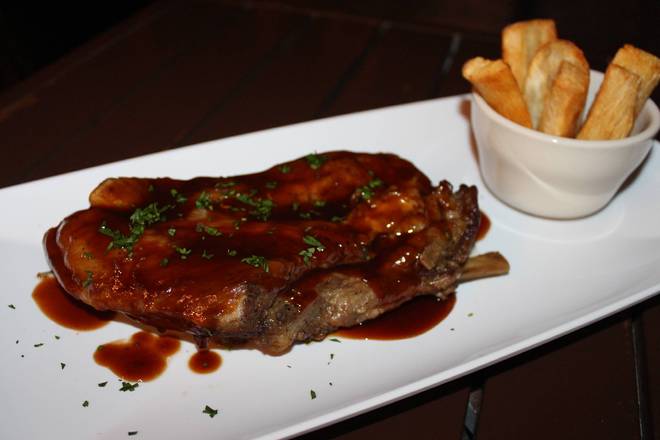 Order Pork Ribs / Costillas de Cerdo food online from La Perrada Colombiana store, Tampa on bringmethat.com