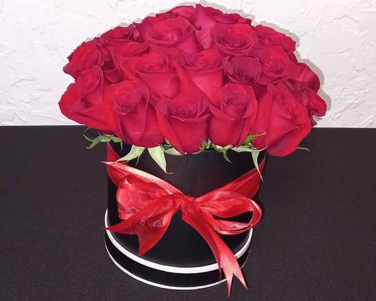 Order Red Roses in Black Bucket food online from Claudia's Flowers store, North Miami on bringmethat.com