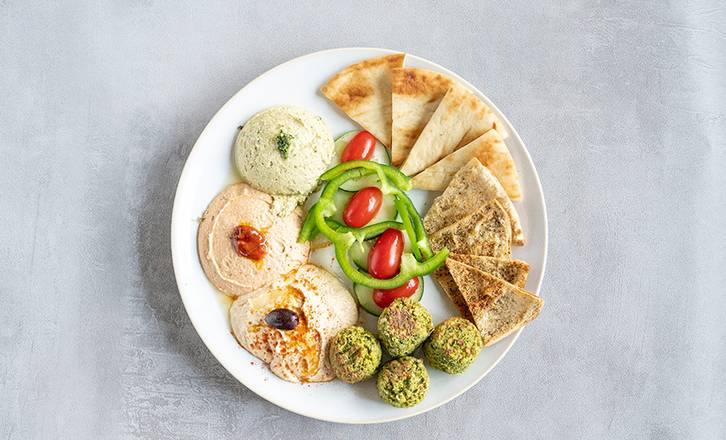 Order Hummus Trio with Falafel food online from Zoe's Kitchen store, Dallas on bringmethat.com