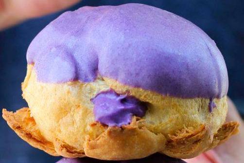 Order Ube Eclair Puff food online from Beard Papa's store, Austin on bringmethat.com