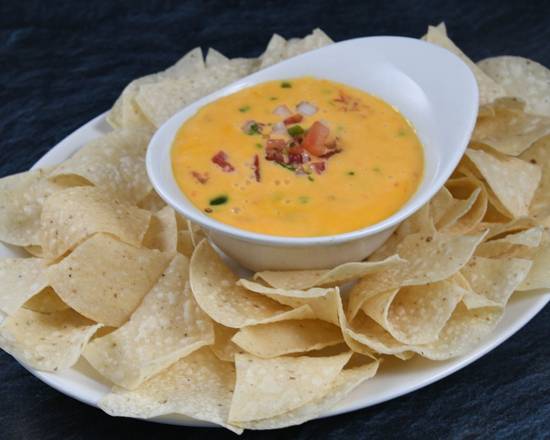 Order Chili Con Queso* food online from Rainforest Cafe - Galveston store, Galveston on bringmethat.com