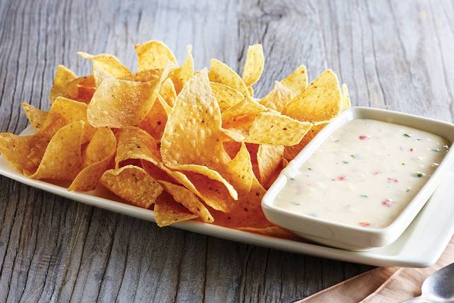 Order White Queso Dip & Chips food online from Applebee store, Manhattan on bringmethat.com