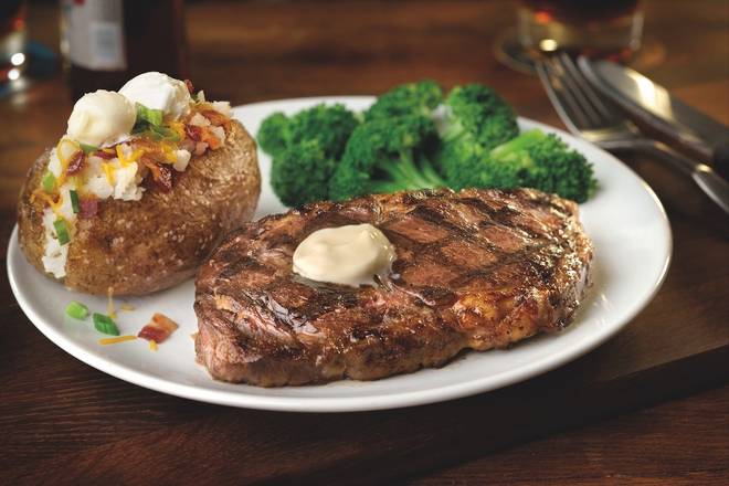 Order 14-oz Fire-Grilled Ribeye food online from Smokey Bones store, Colonie on bringmethat.com