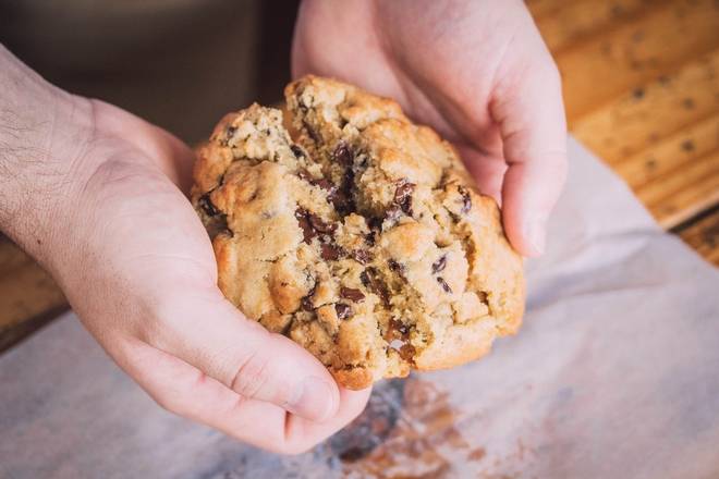 Order John's Jumbo Chocolate Chip Cookie food online from 4 Rivers Smokehouse store, Jacksonville on bringmethat.com