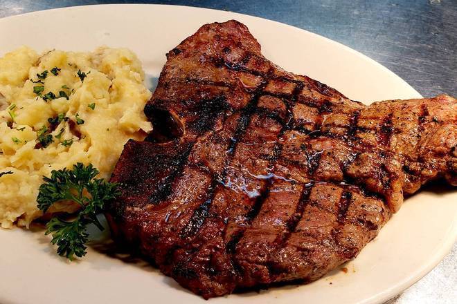Order 20 oz. USDA Choice Porterhouse food online from Harold Seltzer Steakhouse store, St. Petersburg on bringmethat.com