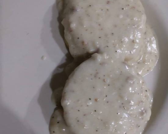 Order 1/2 of Biscuits and Gravy food online from Jans Cafe store, Greenacres on bringmethat.com