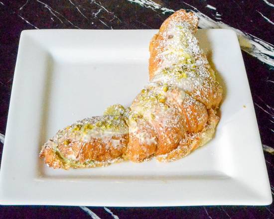 Order Pistachio White Chocolate Almond Croissant food online from Loic Bakery Cafe Bar store, West Palm Beach on bringmethat.com