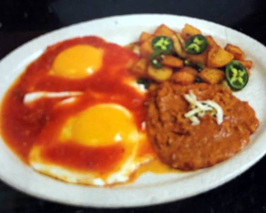 Order Sunny Side Up Eggs (Huevos Rancheros) food online from Ruchis Taqueria store, Houston on bringmethat.com