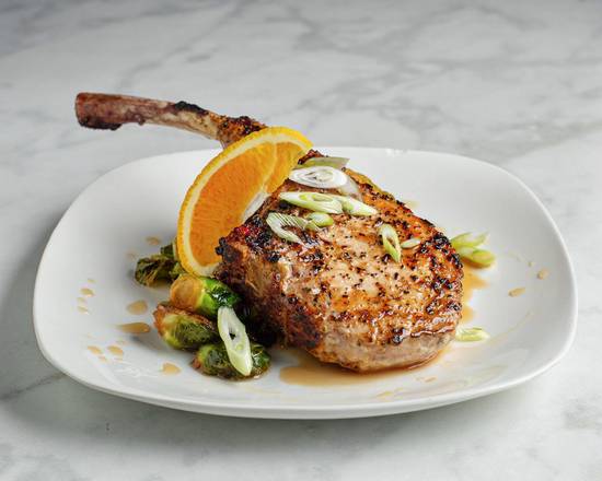Order Frenched Brown Sugar Brined Pork Chop food online from Reign Restaurant store, Saint Louis on bringmethat.com
