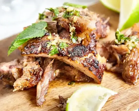 Order Lechon Asado food online from El Tropico Cuban Kitchen store, Aventura on bringmethat.com