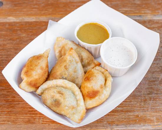 Order Cheddar and Potato Pierogi  food online from Camino store, West Allis on bringmethat.com