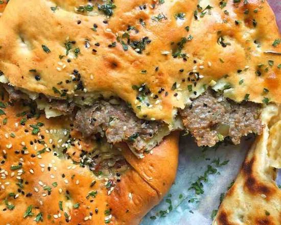 Order Keema Naan (Chicken Stuffed Naan Bread) food online from Hadi Restaurant store, New York on bringmethat.com
