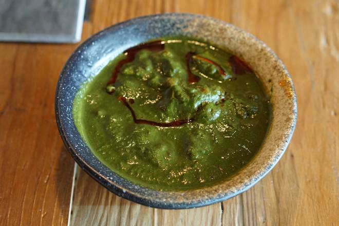 Order Saag Chicken food online from Inchin Bamboo Garden store, Nashville on bringmethat.com