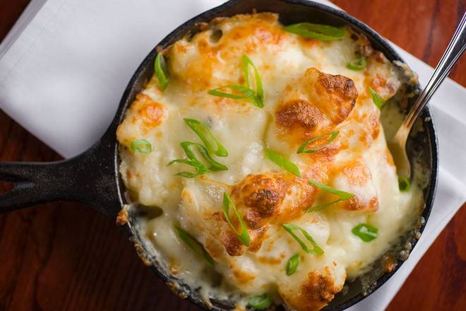 Order WHITE CHEDDAR & BACON AU GRATIN POTATOES food online from Sullivan's store, Omaha on bringmethat.com