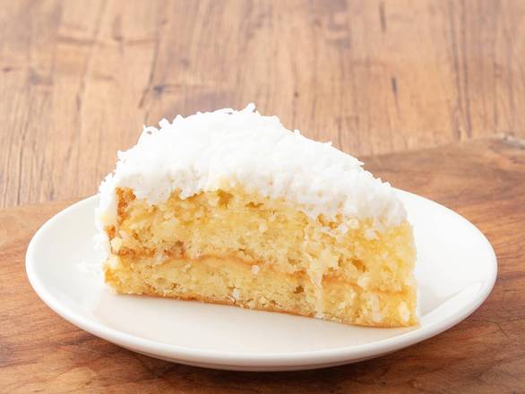 Order Coconut Cream Cake food online from La Madeleine Country French Cafe store, Harahan on bringmethat.com